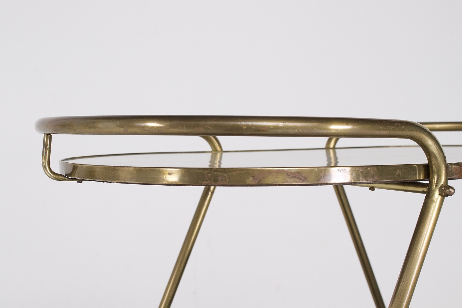 Curved brass structure of a 1960s trolley