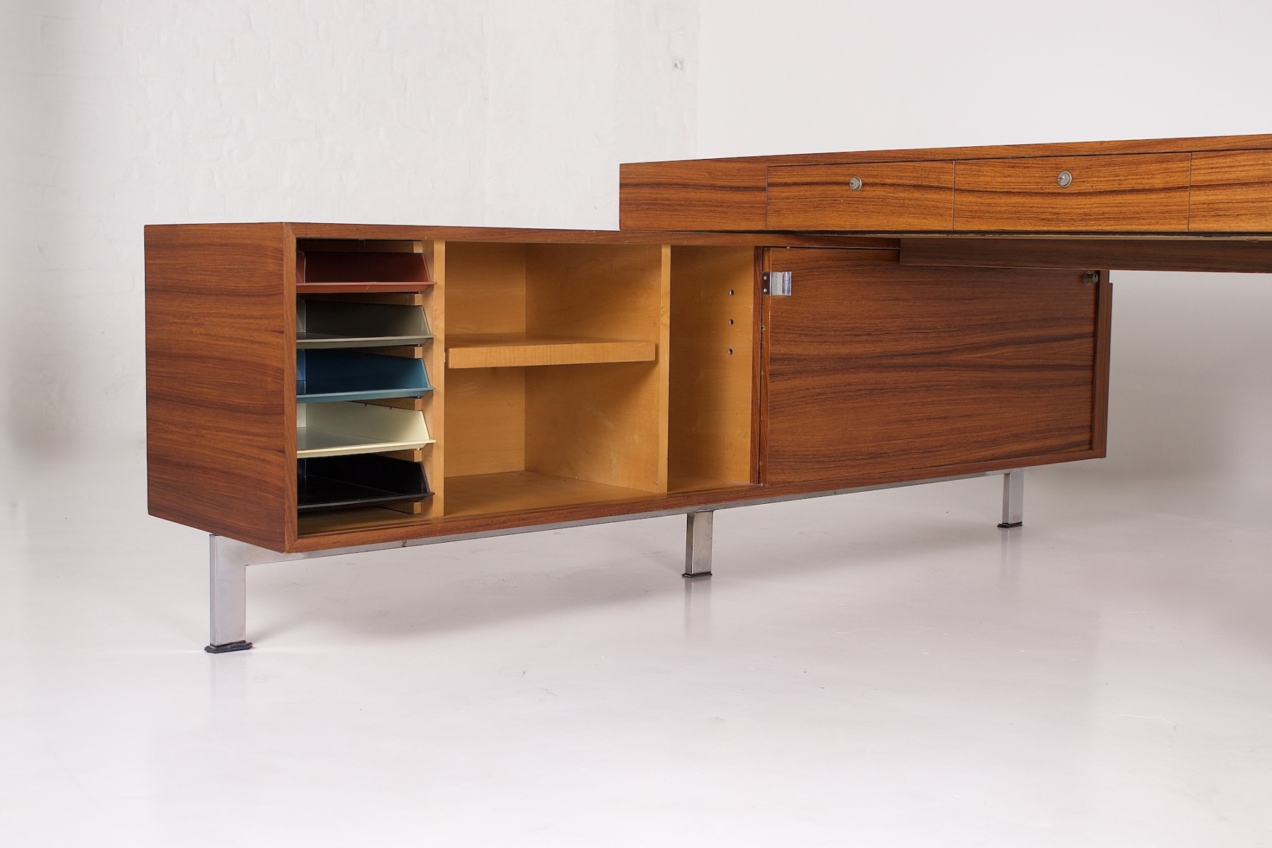 Storage compartments of a 1970s walnut office furniture
