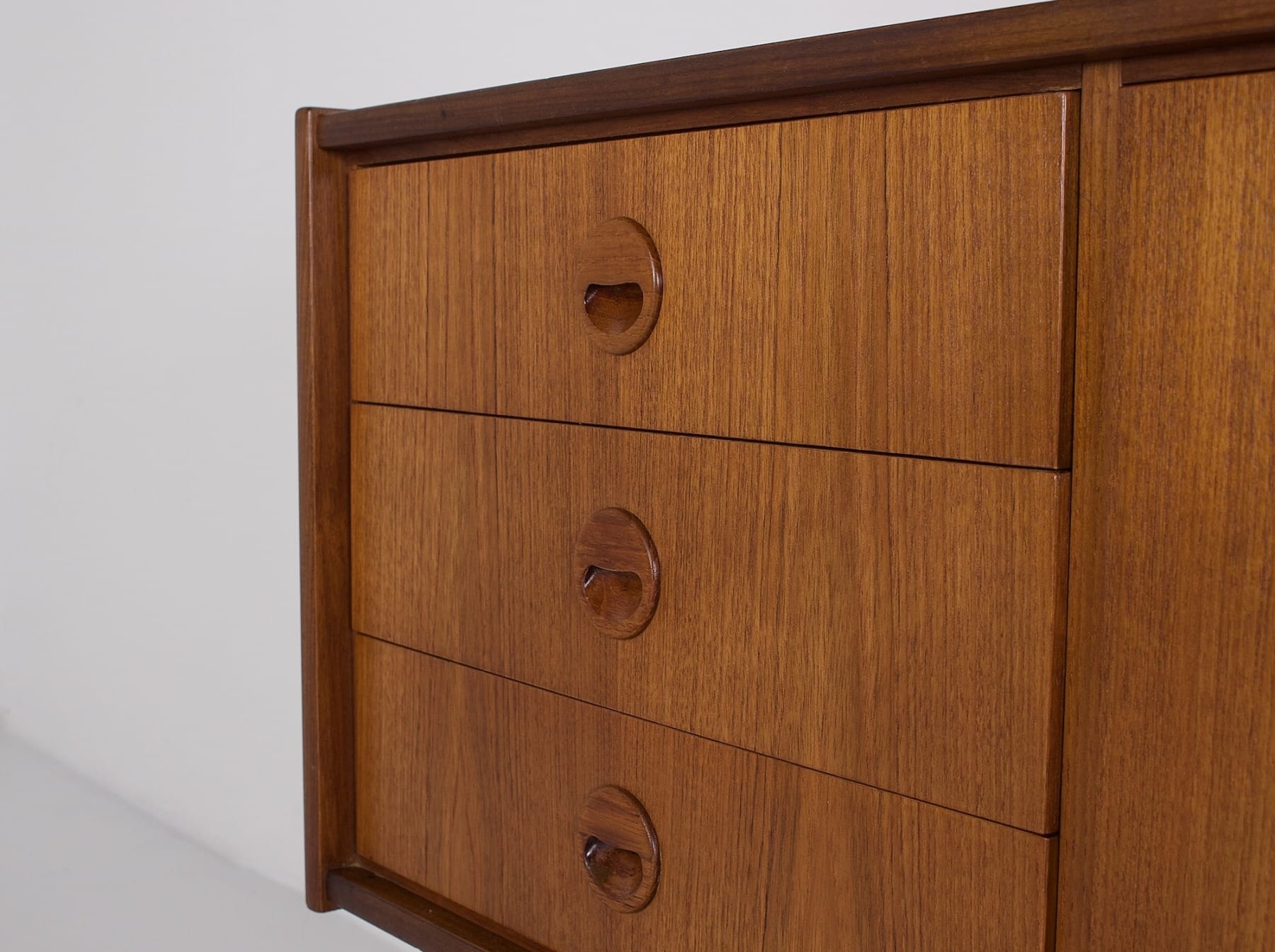 Scandinavian-style drawer handles on the 1960s teak sideboard