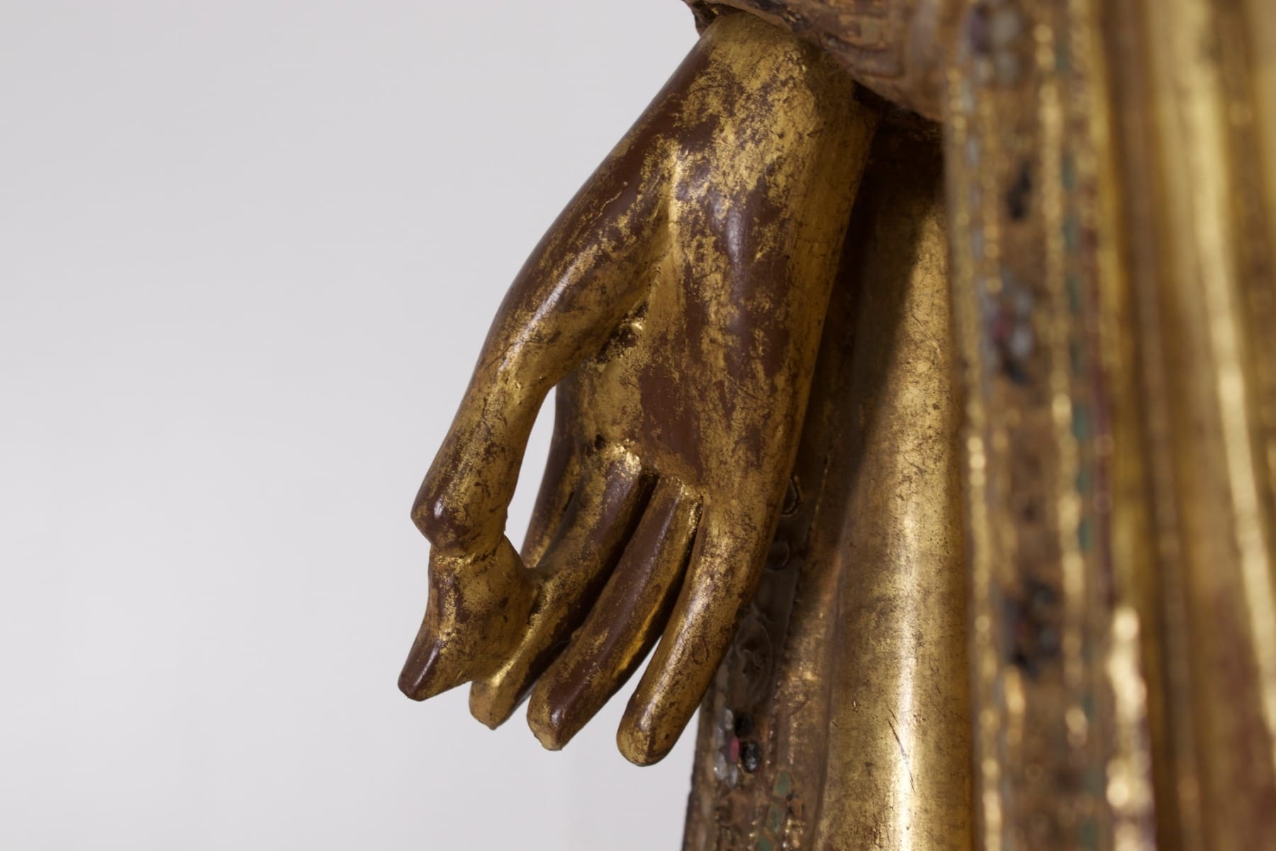 the hand of the Awakened One holding the fruit of healing, the myrobalan